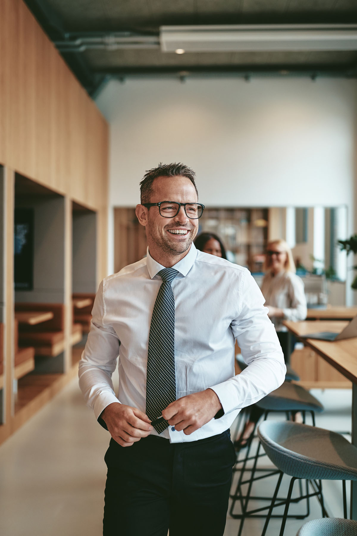 Confident professional in modern office representing business financial strategy and leadership planning support
