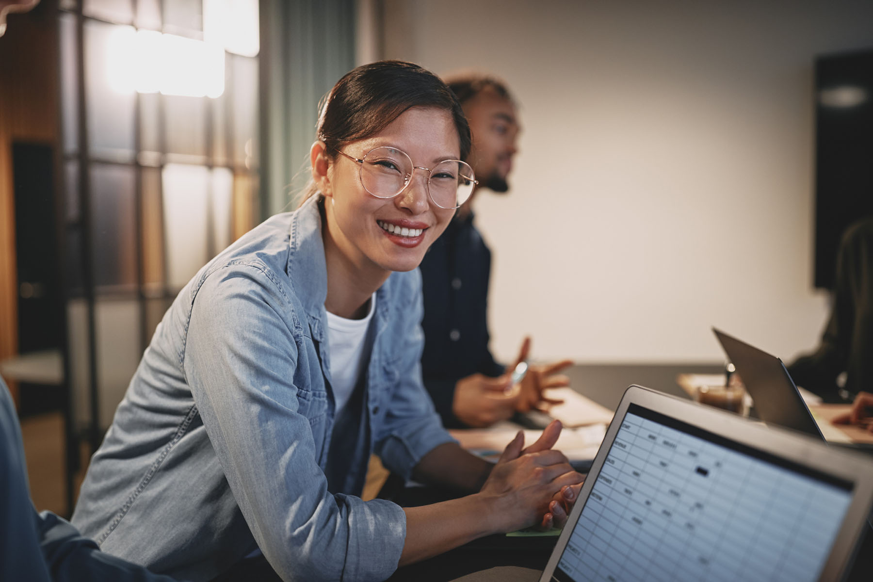 Financial professional reviewing documents representing collaborative planning and client-focused advisory services